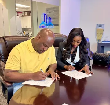 Dominique S. and her husband signing their VA construction loan closing documents